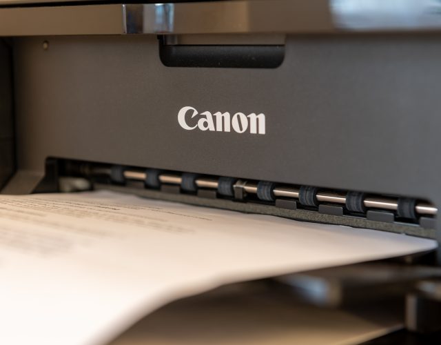 London. UK- 12.07.2022. Close up of a Canon inkjet printer with the company name, trademark on the product.